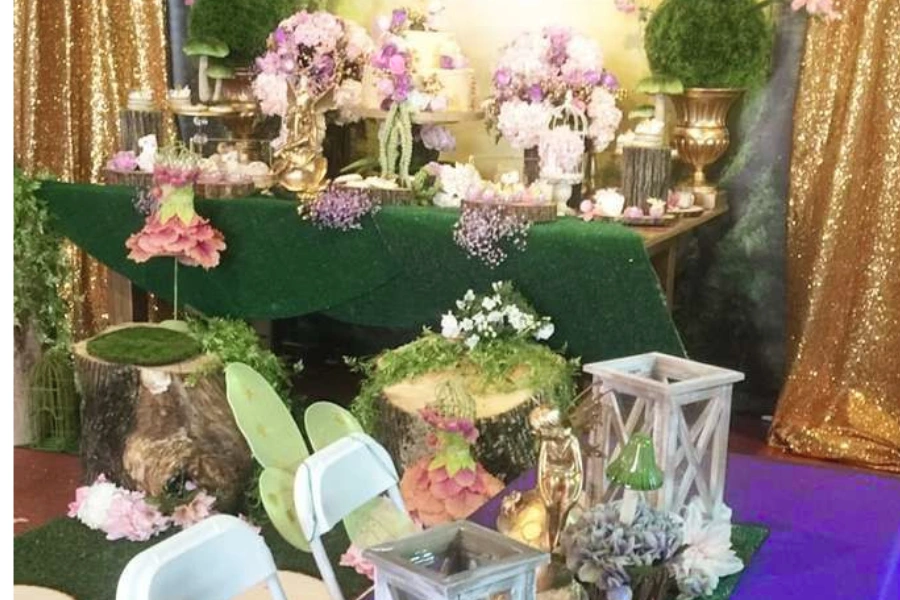 Artificial moss table runner with wood slices for woodland party