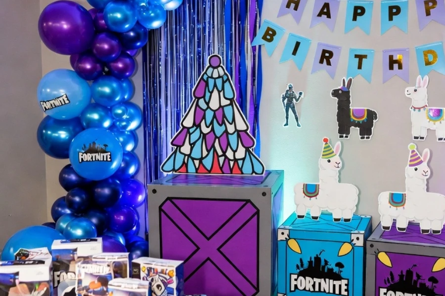 fortnite birthday party decorations with balloons and themed table setup