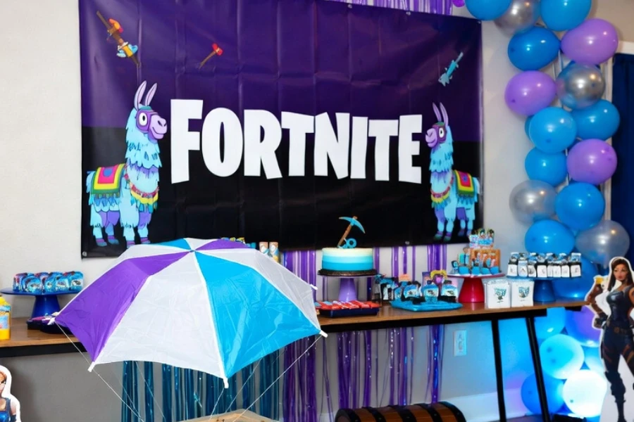 fortnite themed party decorations with llama banner and supply drop props