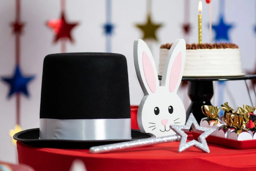 classic magician party decorations including hat rabbit wand and star props